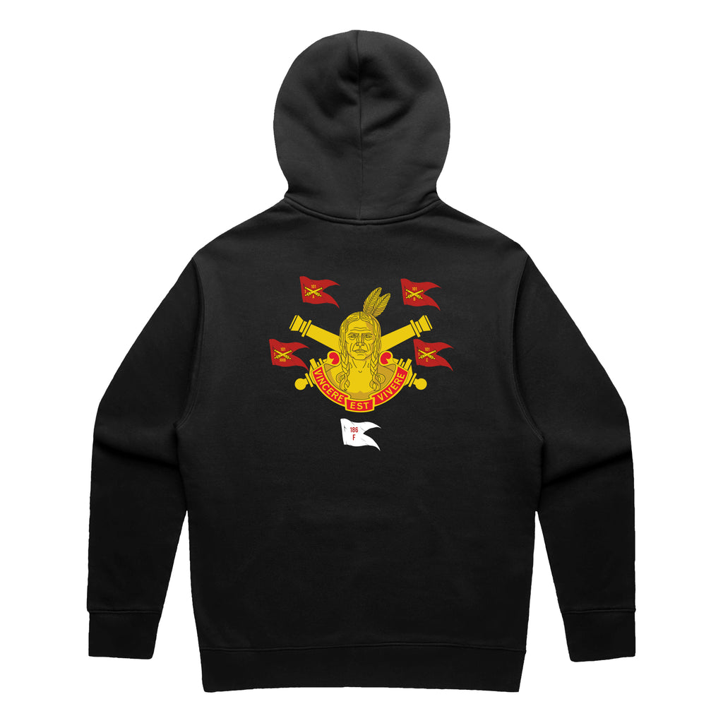 Back view of a black pullover hoodie featuring the 101st Field Artillery Regiment heritage graphic. The design includes a central figure of a Native American warrior, crossed artillery cannons, and multiple red guidons marked '101.' A red banner at the bottom reads 'VINCERE EST VIVERE' and a small white flag below shows '186 F'.