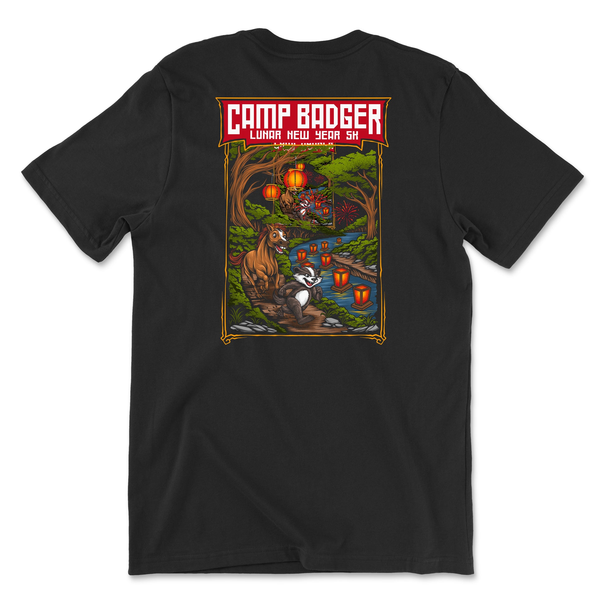 Back view of a black t-shirt for the Camp Badger Lunar New Year 5K. The large rectangular graphic features a festive night scene with a badger and a horse standing by a river lit by glowing red lanterns. The text 'CAMP BADGER' is displayed in bold at the top, followed by 'LUNAR NEW YEAR 5K' against a background of a forest, a bridge, and fireworks in the sky.
