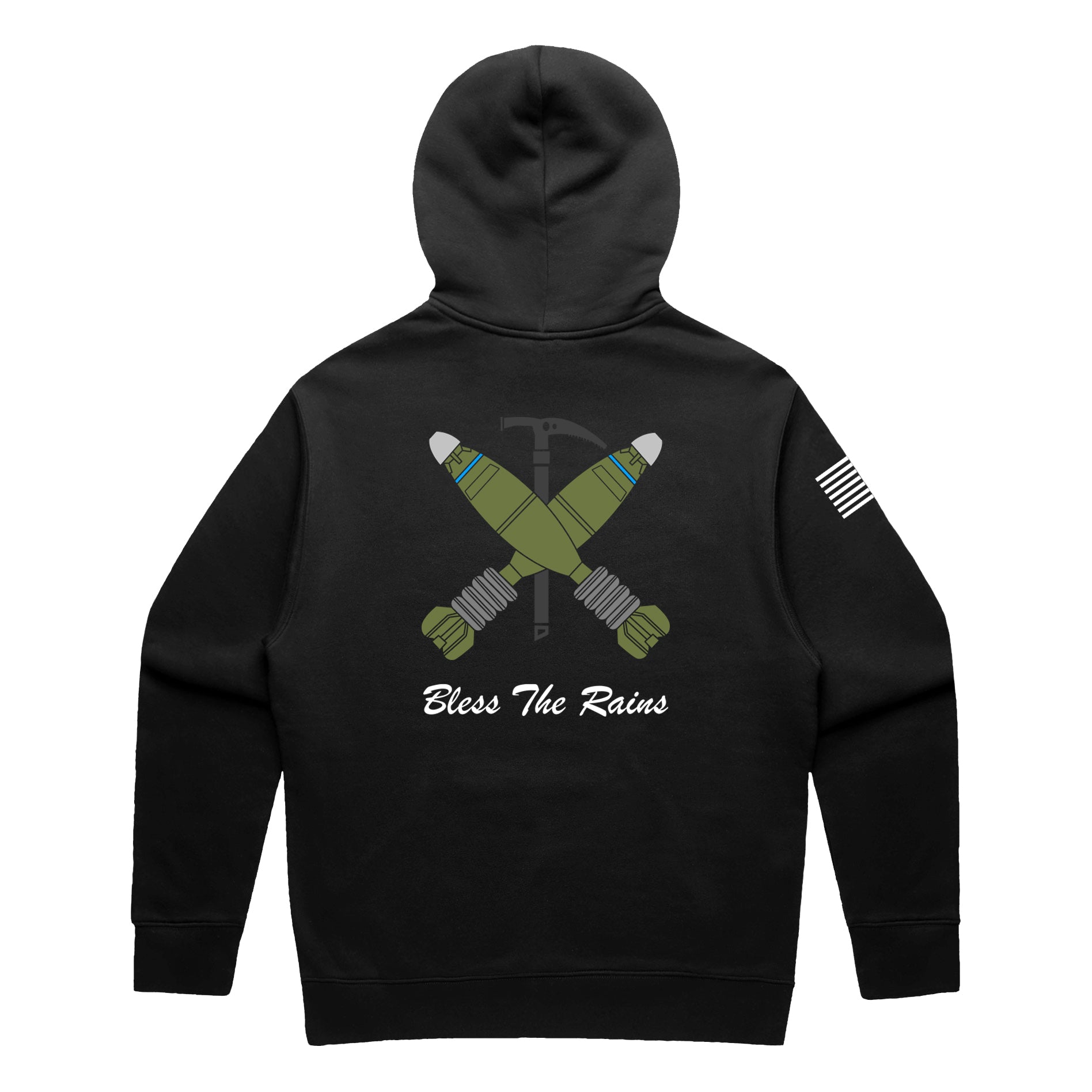 Back view of a black pullover t-shirt featuring a tactical graphic. The design shows two green mortar shells crossed over a black ice axe. Below the graphic, the text 'Bless The Rains' is written in white cursive script. A white American flag patch is visible on the right sleeve.