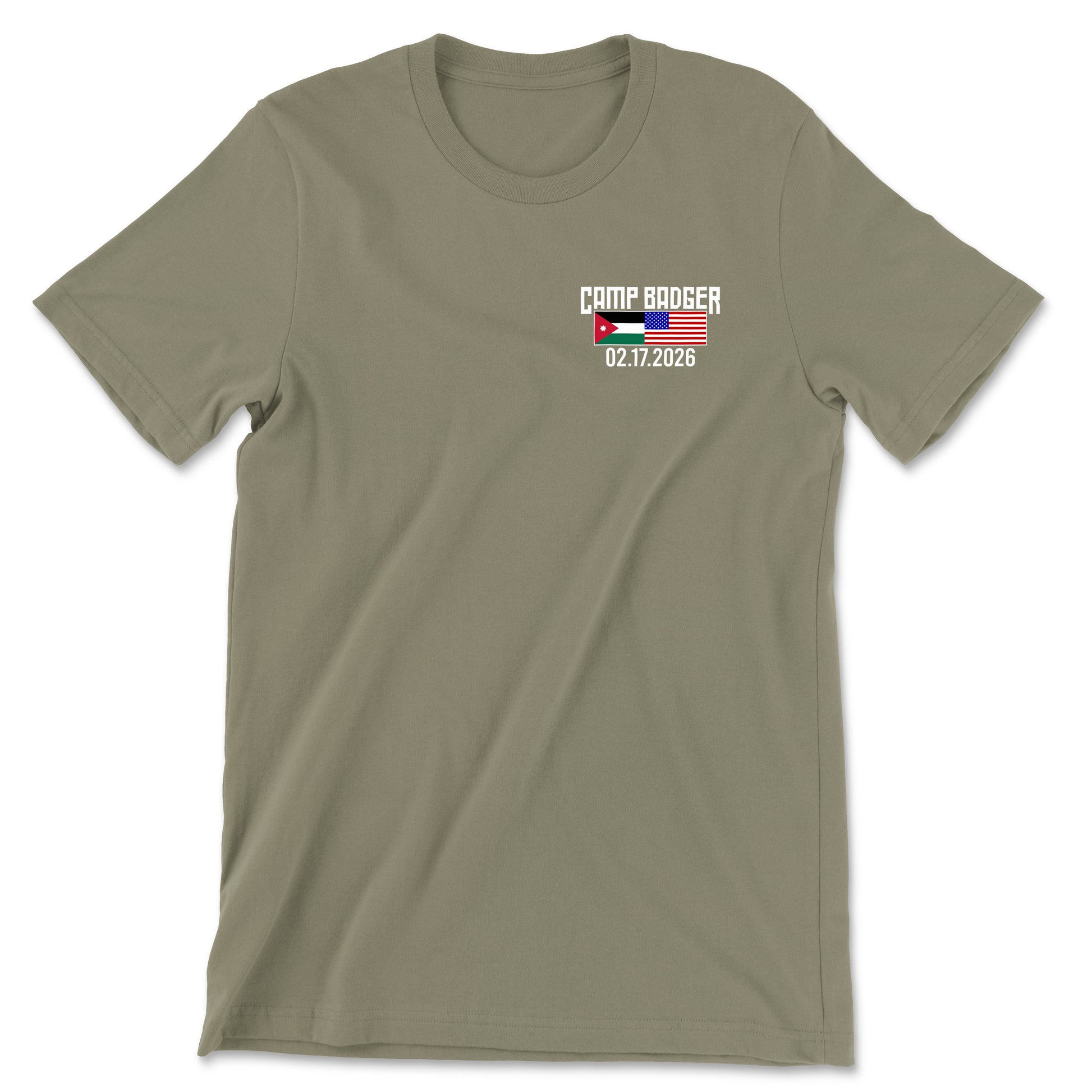 Front view of a coyote brown t-shirt for the Camp Badger Lunar New Year 5K. The left chest features a small graphic with the text 'CAMP BADGER' above the date '02.17.2026.' The design includes the national flags of Jordan and the United States side-by-side.
